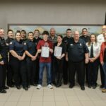 The fire department officers and a youth receiving the Kenosha County Heroes Among Us Commendation.