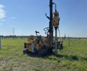 Pile driver pounding steel racking foundations